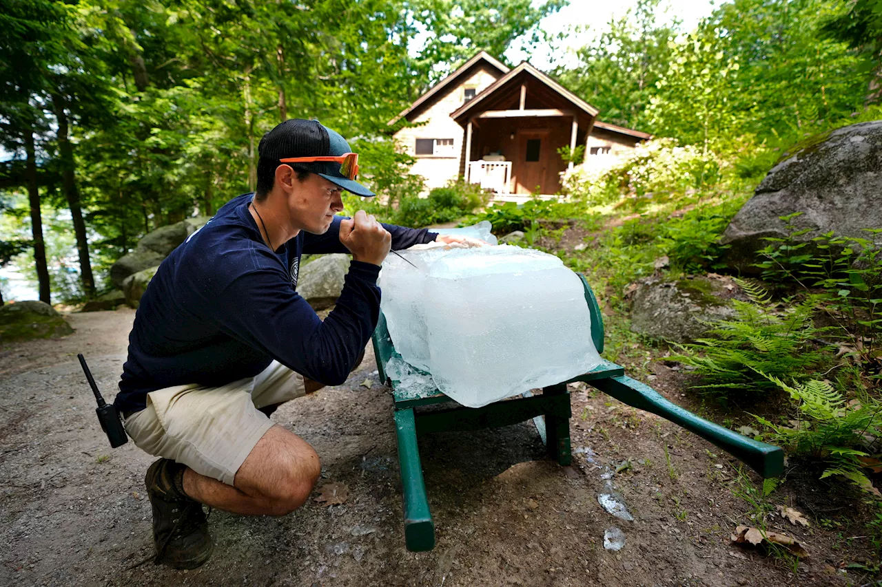 As millions sweat out the heat wave, blocks of lake ice keep these campers cool