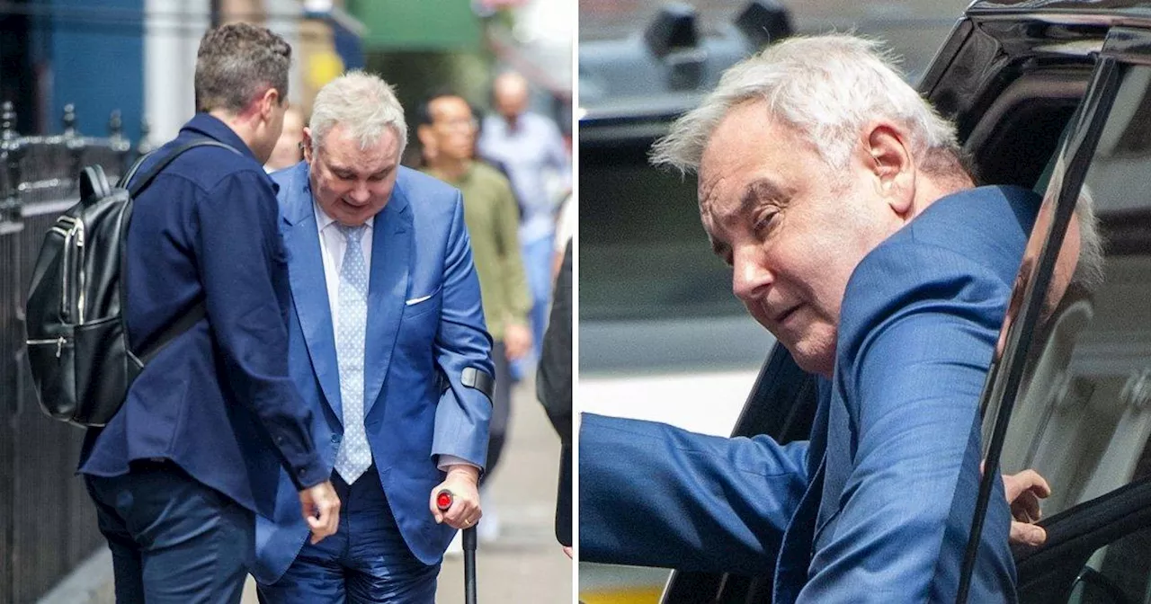 Eamonn Holmes grimaces using crutches to aid him after health problems