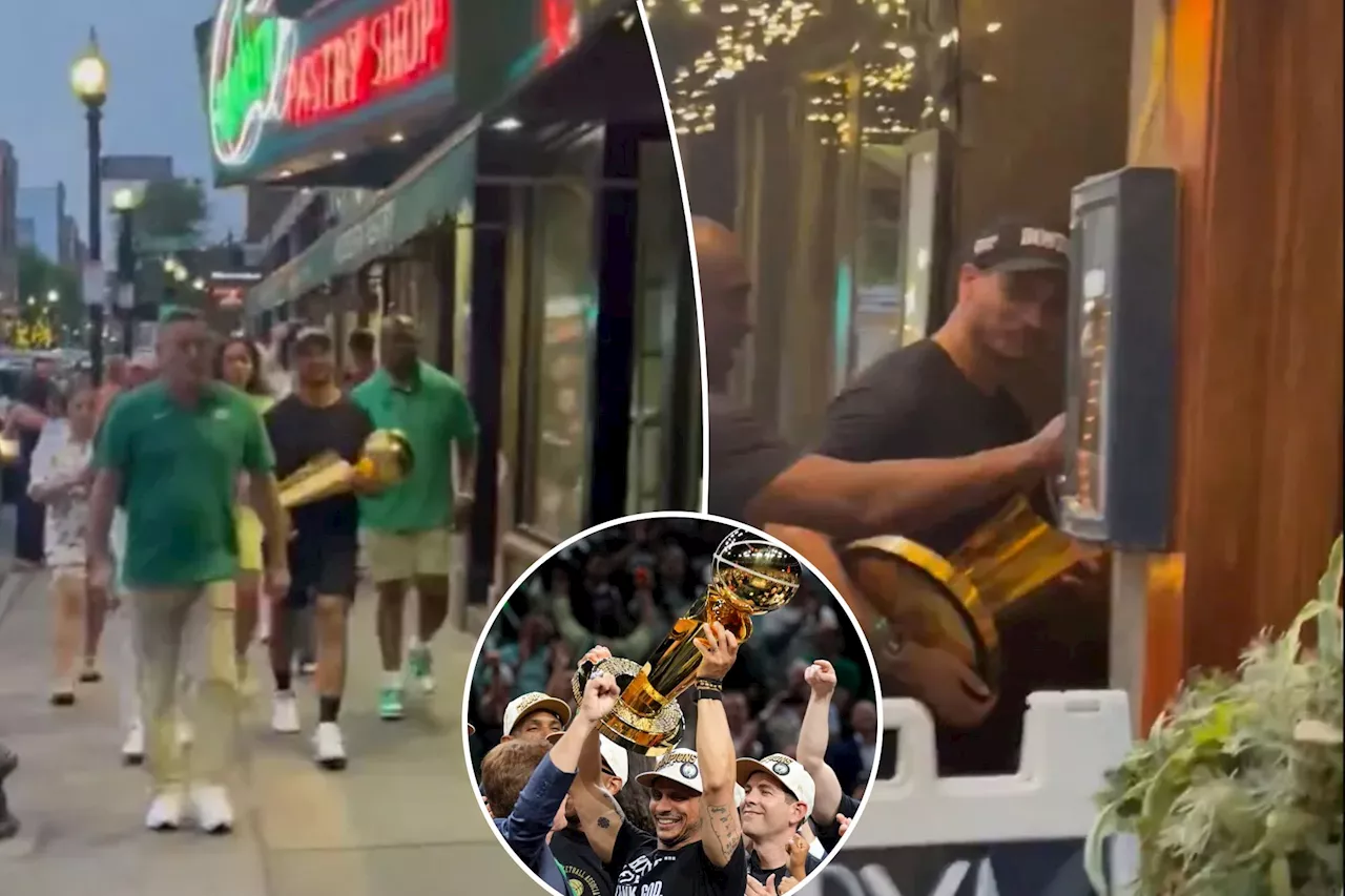 Celtics coach Joe Mazzulla shows off NBA Finals trophy while waltzing around Boston