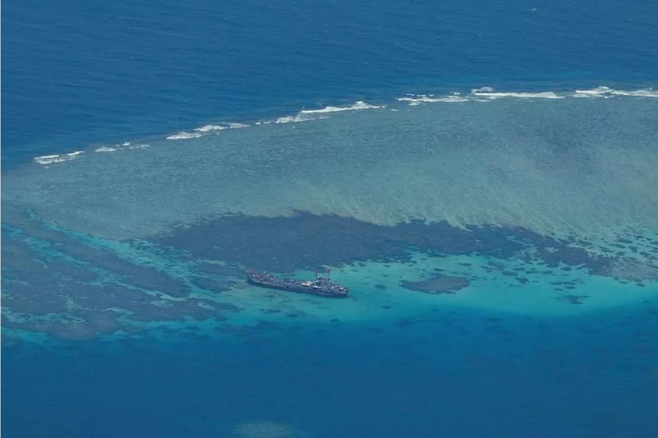 Chinese sailors wield knives, axe in disputed sea clash with Philippines