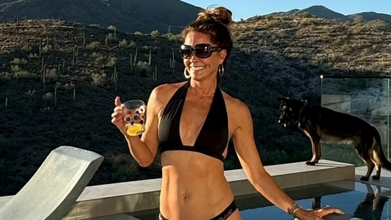 Brooke Burke, 52, poses in a tiny bikini