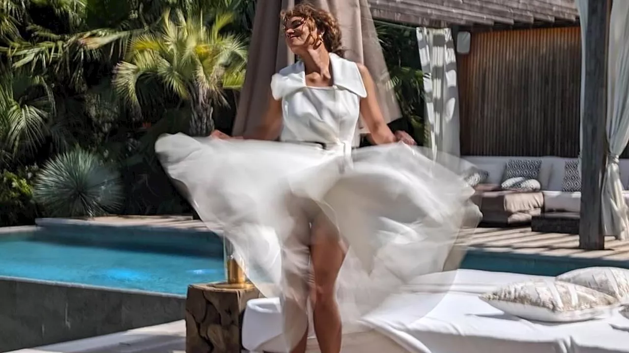 Halle Berry, 57, flashes her underwear as she has her Seven Year Itch moment in a dress that...