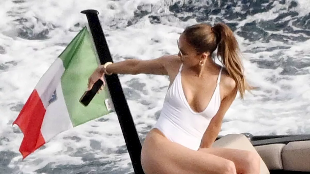 Jennifer Lopez, 54, takes RACY selfies of her famous posterior while rocking a plunging white...