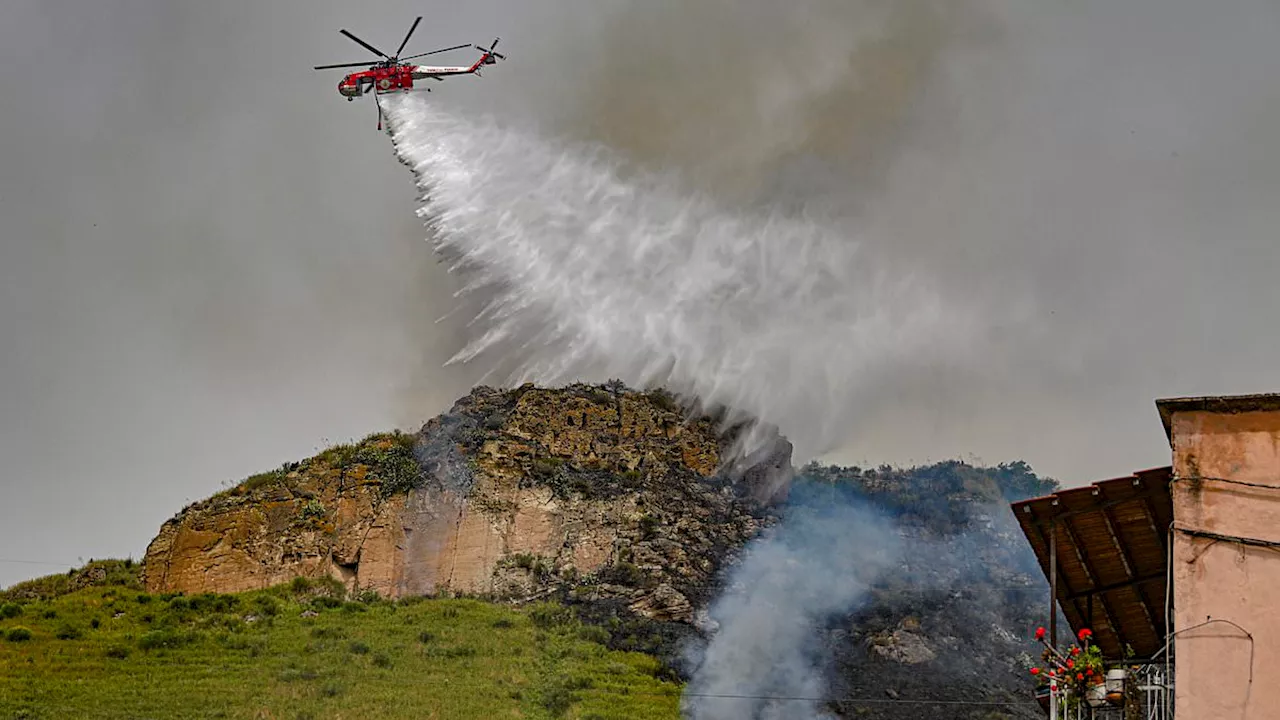 Europe's crazy weather: Italy bakes in 42C heatwave and wildfires rip through Turkey while Majorca...