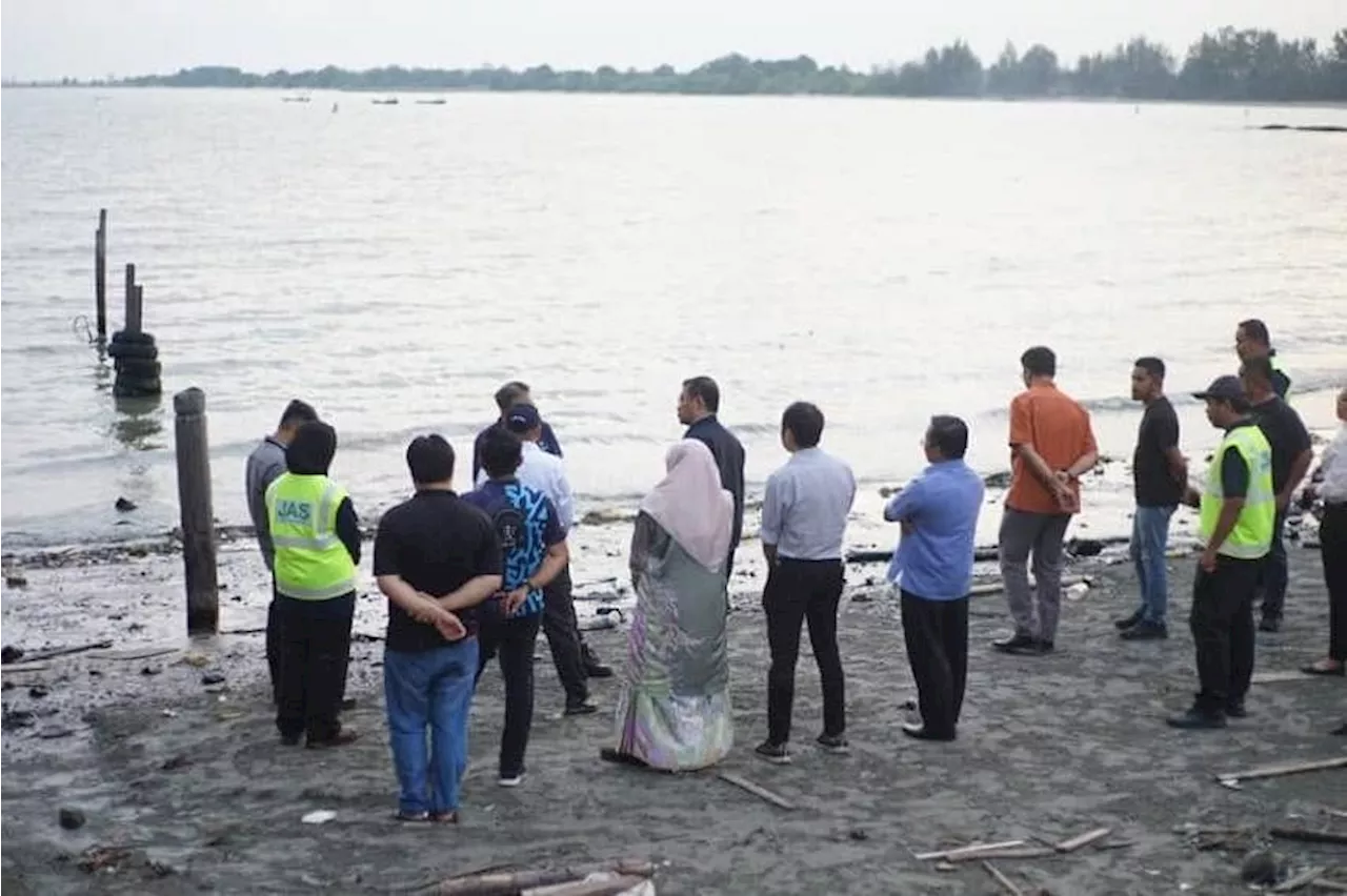 Cleanup under way at two Johor beaches blackened by Singapore oil spill