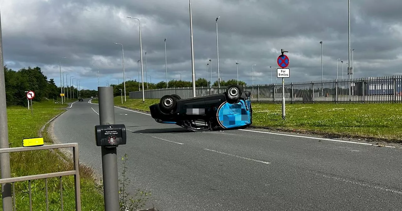 Van flips onto roof after Switch Island crash causing long delays