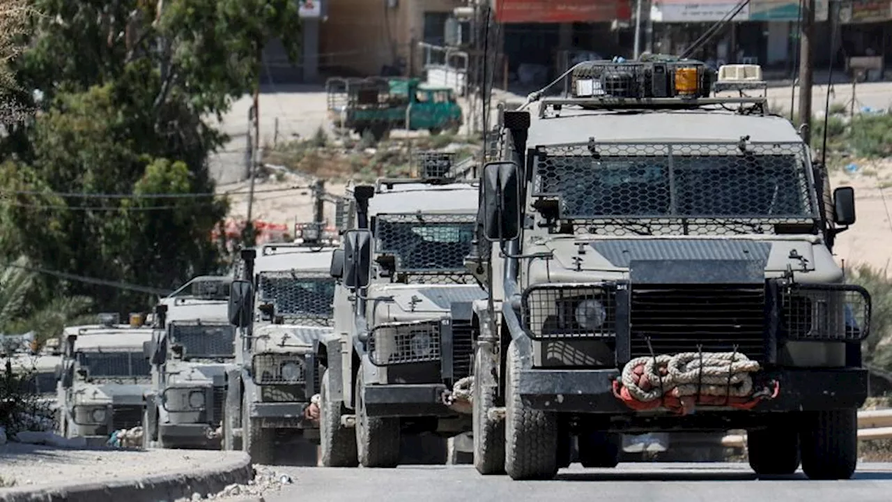 Israeli military straps injured Palestinian man to hood of jeep