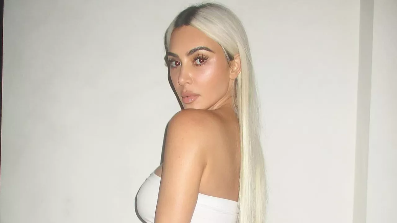 Kim Kardashian makes jaws drop as she flaunts her famous curves in a SKIMS minidress