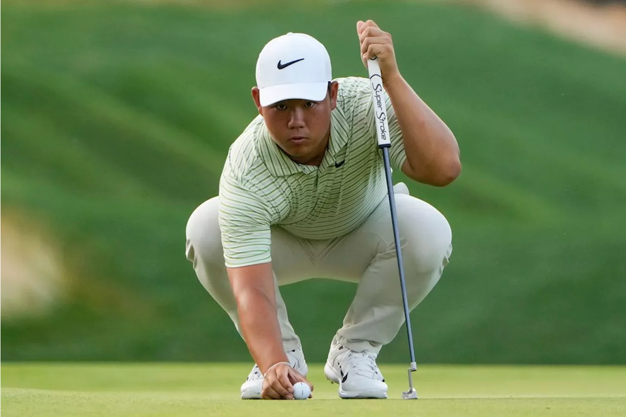 Tom Kim clings to a 1-shot lead over Scheffler and Bhatia in rain-delayed Travelers