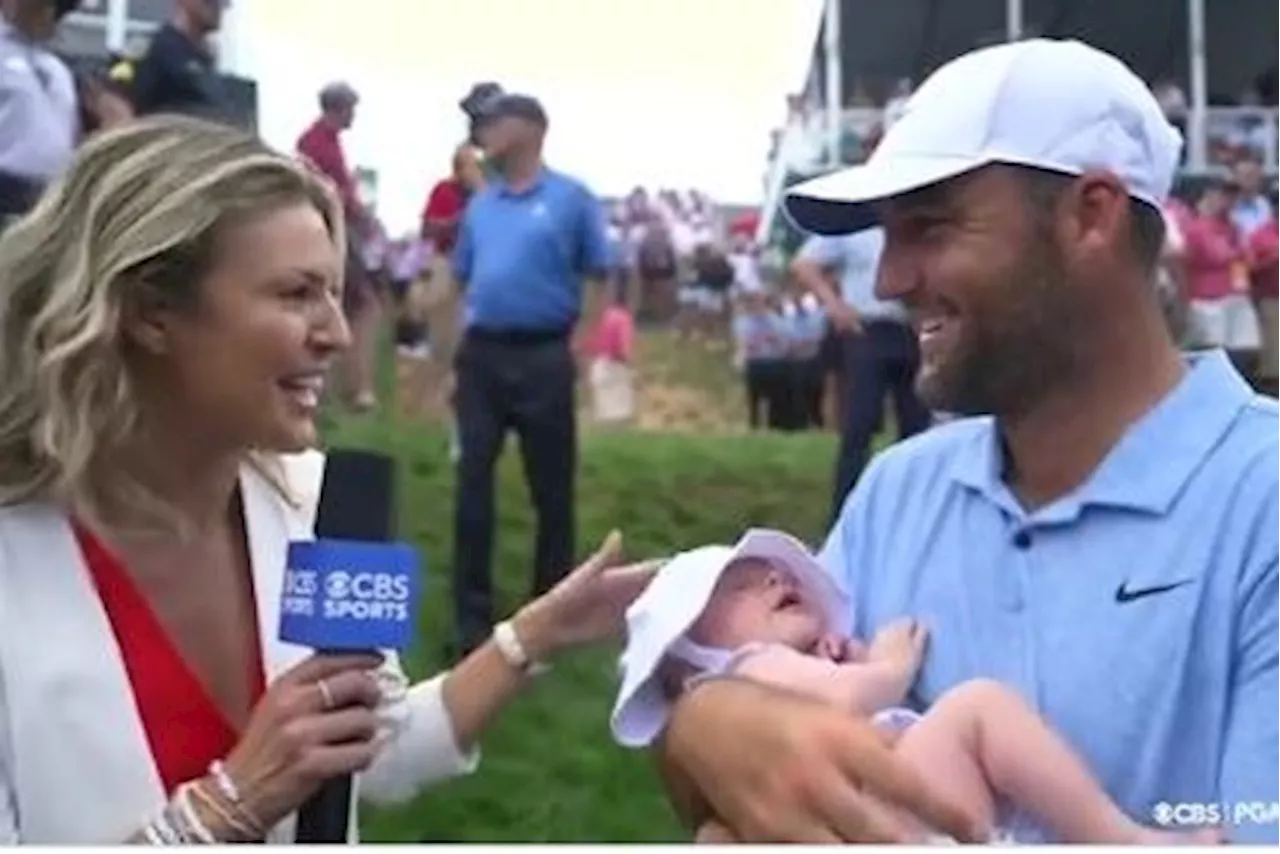 Scottie Scheffler holds baby during Amanda Balionis interview after Travelers protester chaos