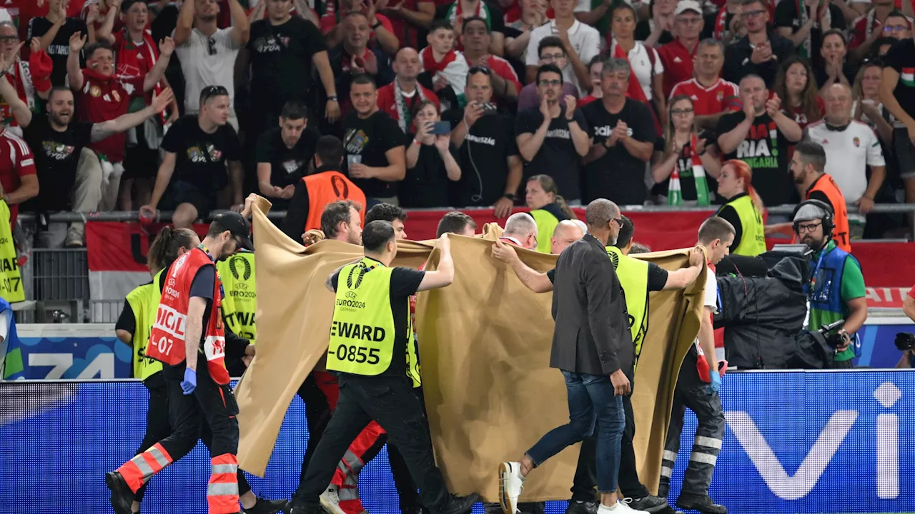 Liverpool’s Dominik Szoboszlai in tears as Hungary’s Barnabas Varga stretchered off after nasty collision a...