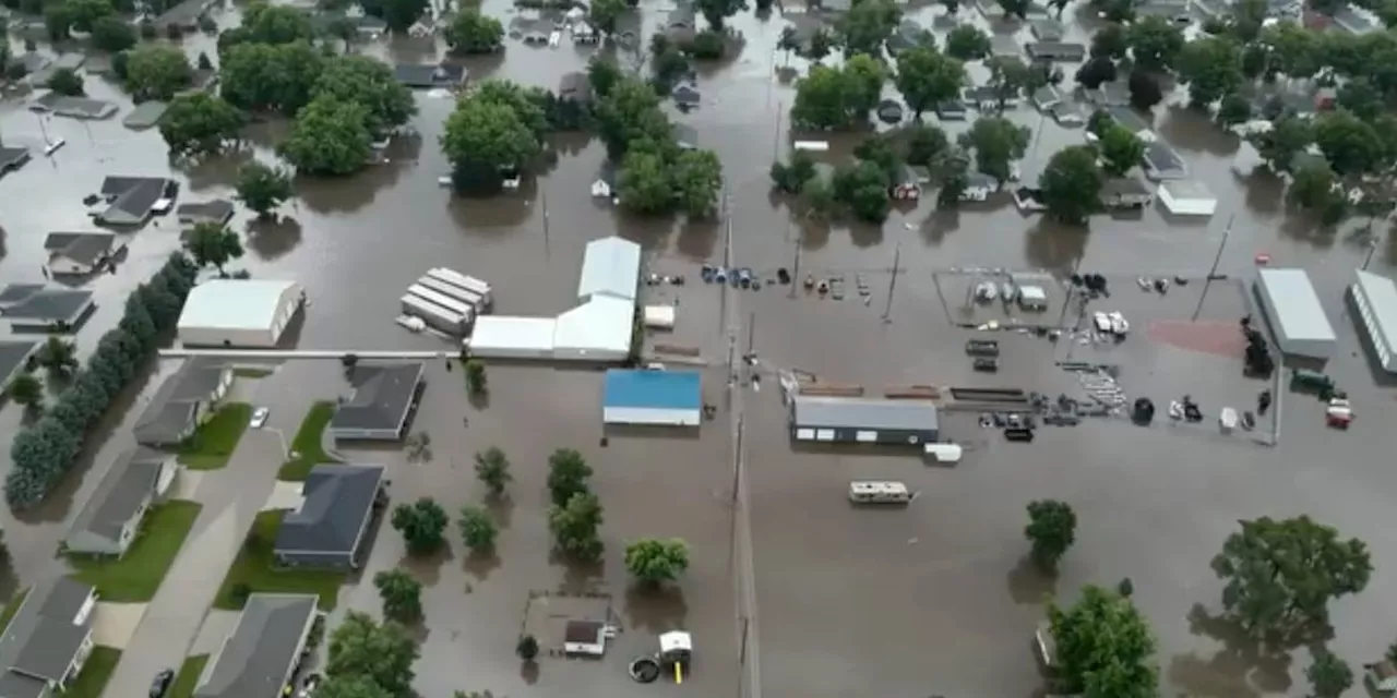 Midwest flooding collapses rail bridge, forces evacuations and kills at least 1