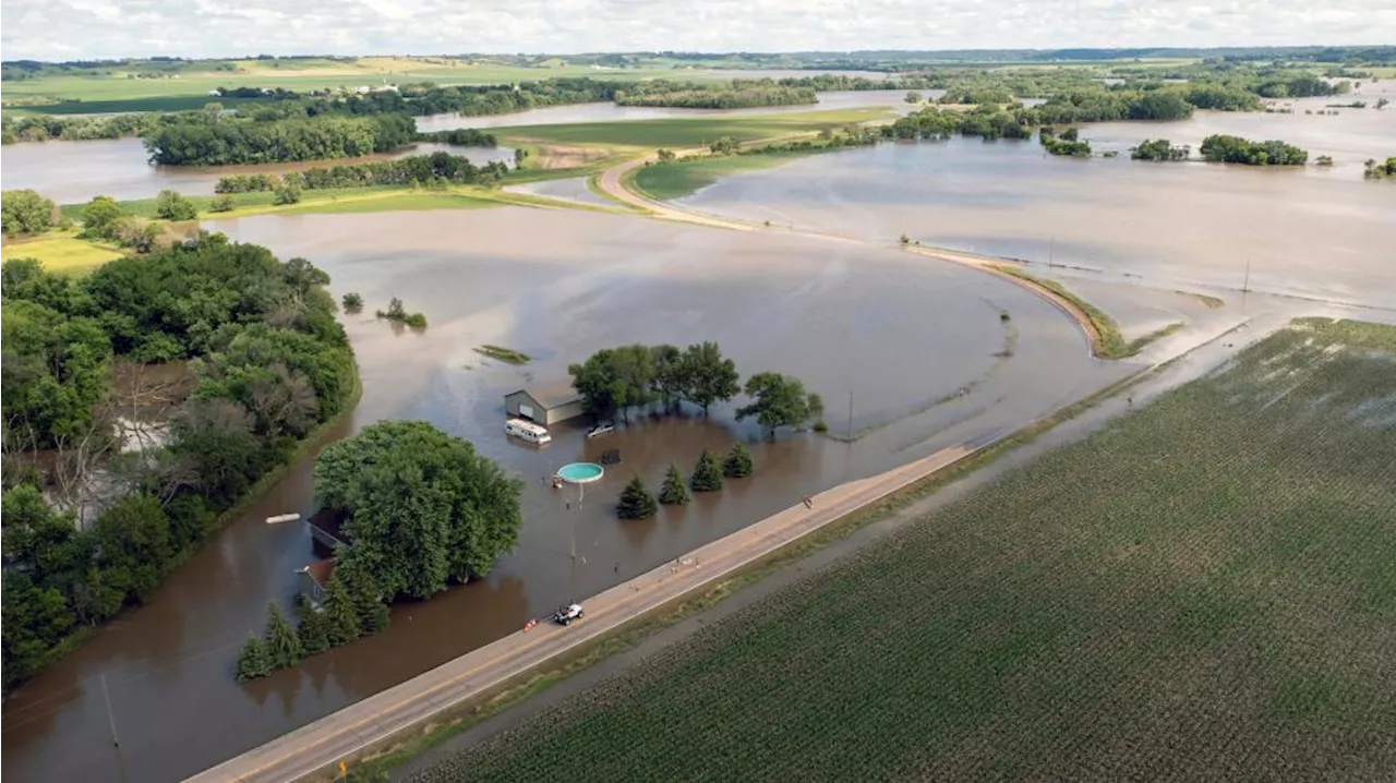 Midwestern flooding collapses a bridge, forces evacuations and kills at least 1