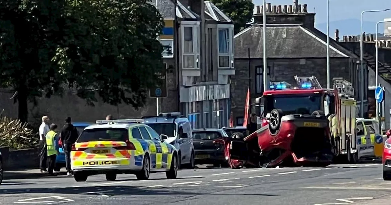 Car flips on Scots street as injured male driver rushed to hospital