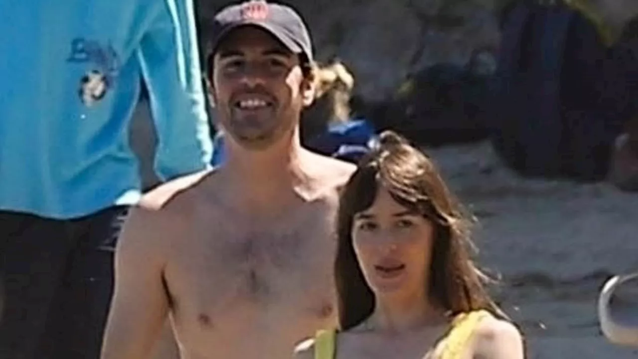 Dakota Johnson sizzles in yellow bikini as she splashes around the beach in Malibu with BFF Jeremy...