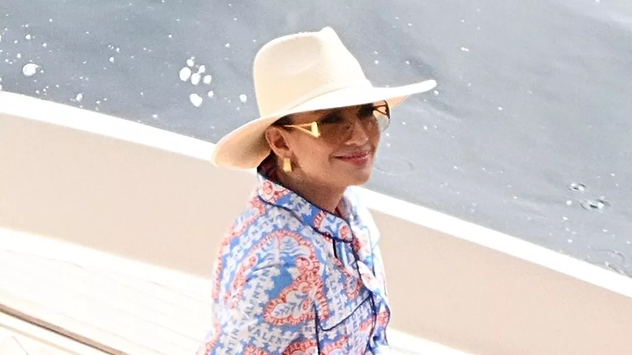 Jennifer Lopez brushes off divorce speculation from husband Ben Affleck as she flashes a beaming...