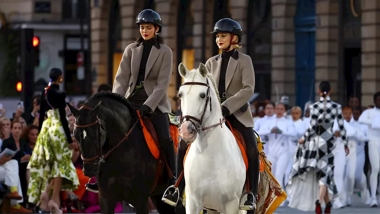 Kendall Jenner and Gigi Hadid ride the runway on Hermes dressed horses as they are joined by Sabrina...