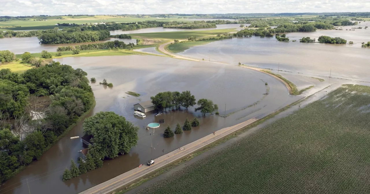 Midwest flooding collapses a rail bridge, forces evacuations and kills at least 1