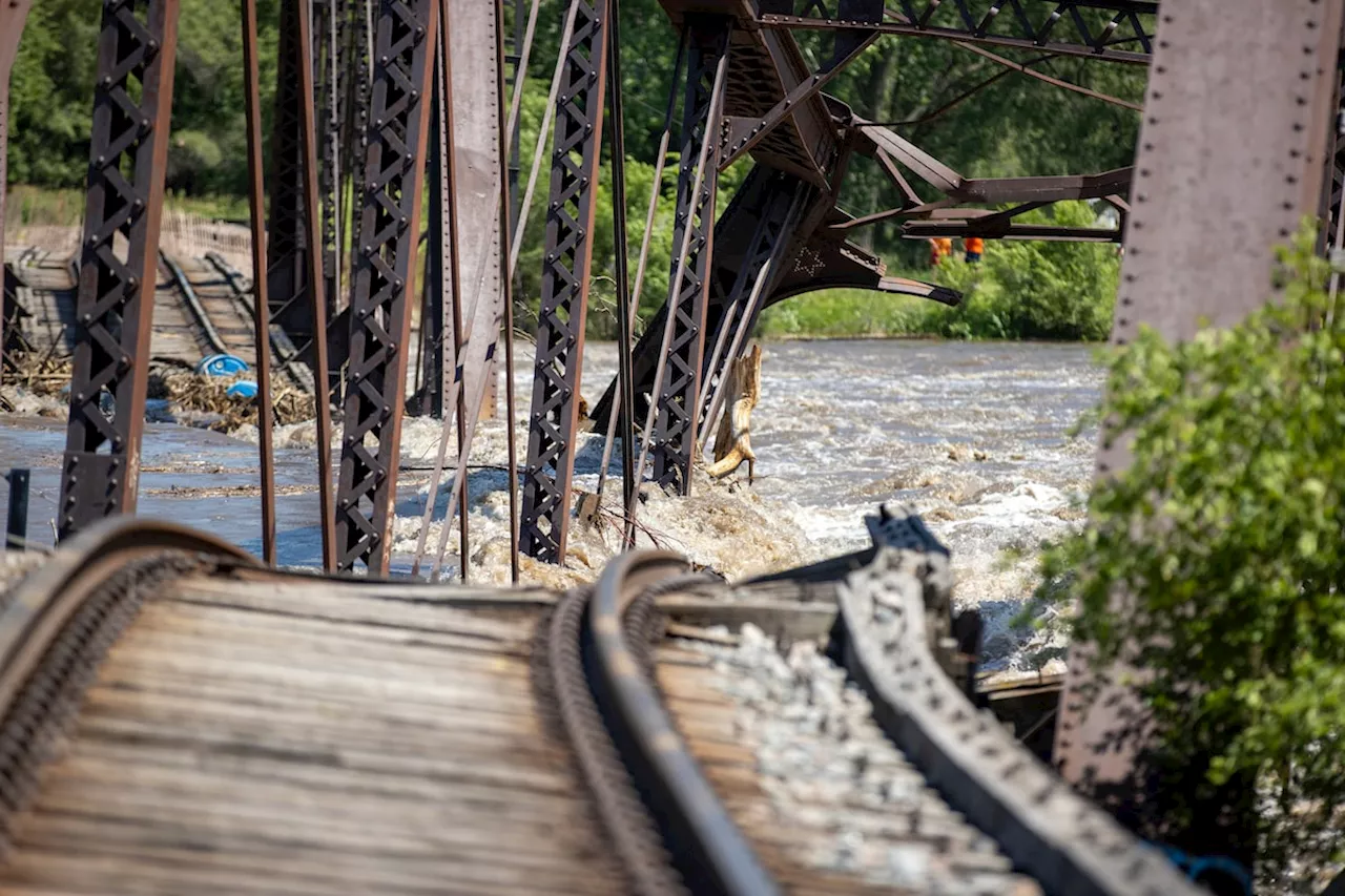 Midwestern flooding collapses a bridge, forces evacuations and kills at least one