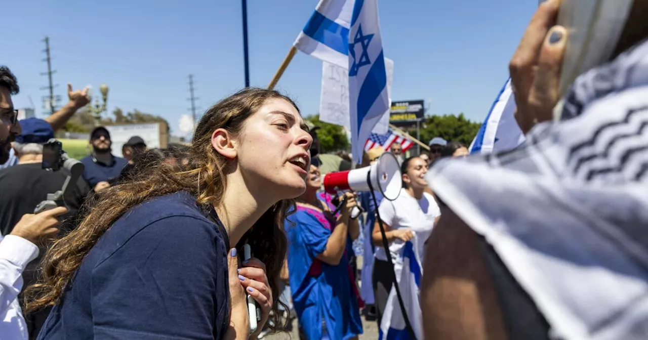 Pro-Palestinian activists and Israel supporters clash outside West L.A. synagogue