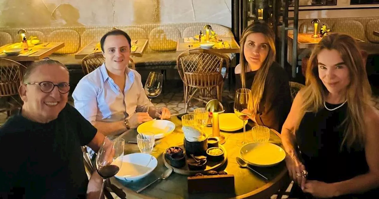 Em jantar com Galvão Bueno, 'cara fechada' de esposa de Felipe Massa chama atenção