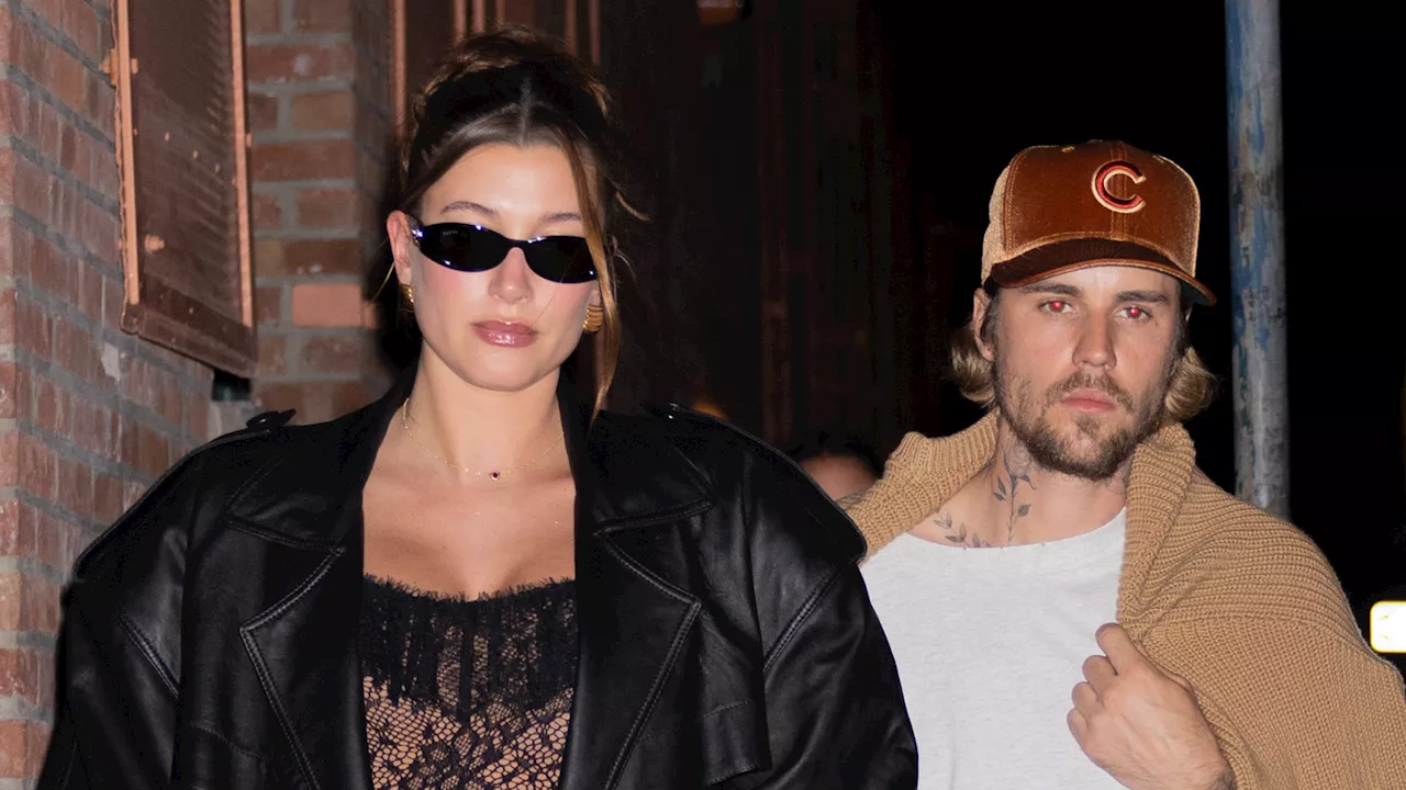 Pregnant Hailey Bieber stuns in tight nude lace catsuit and heels while Justin wears baggy shorts &...