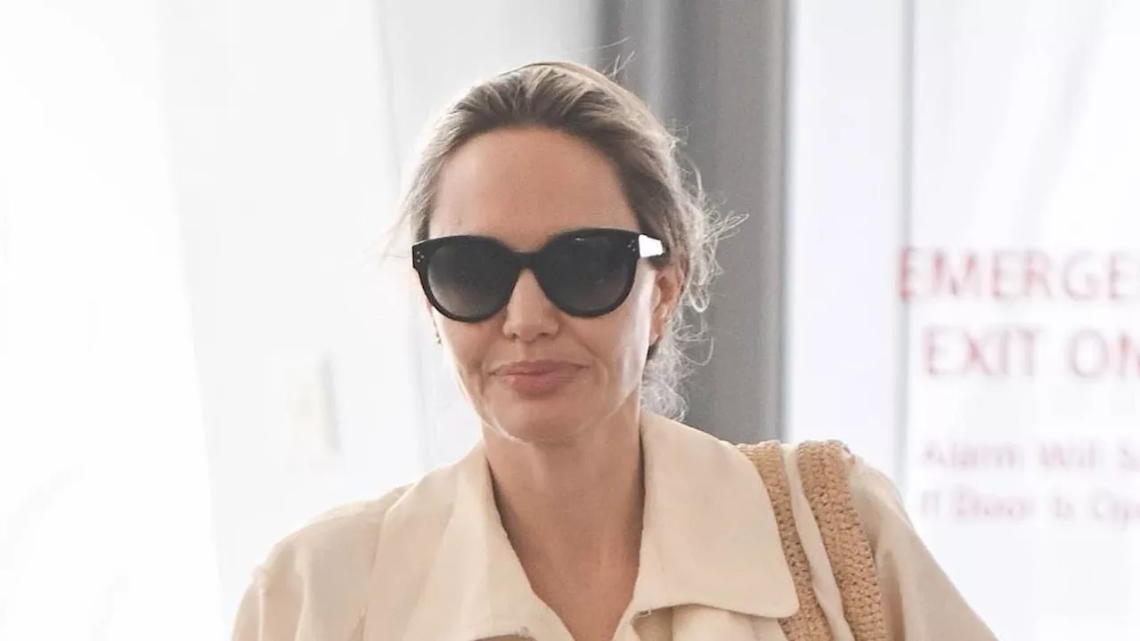 Angelina Jolie arrives to JFK airport with daughter Vivienne, 15, following their Tony Awards win...