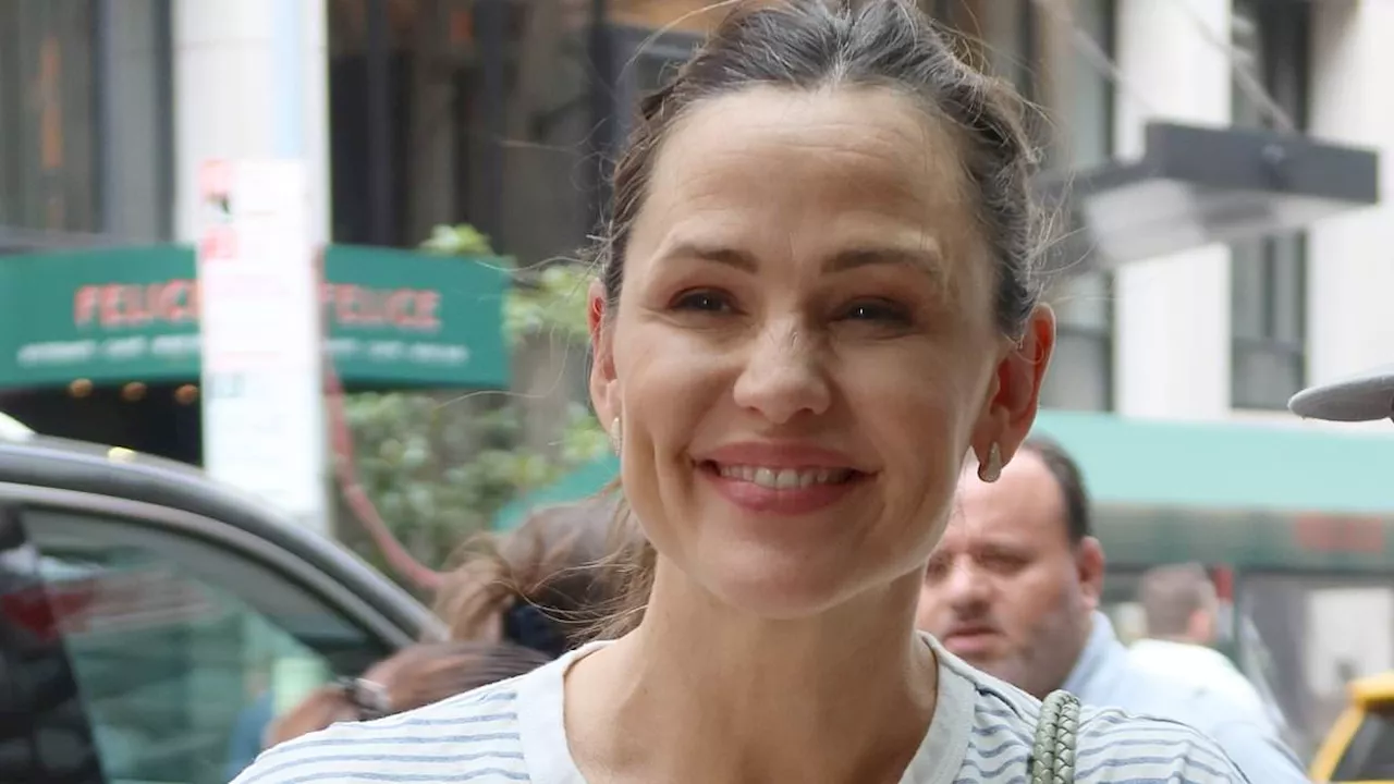 Jennifer Garner looks jovial signing autographs for fans in NYC - as she continues to remain upbeat...