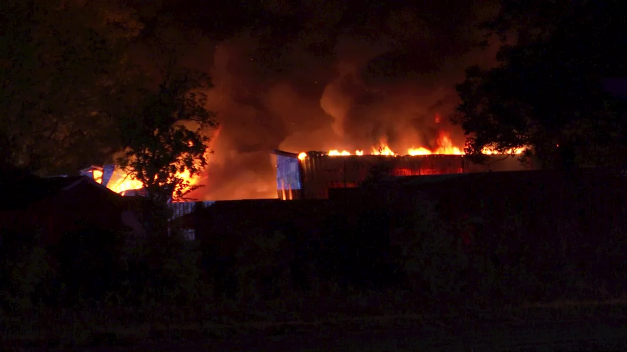 Rosenburg fire: Firefighters shuttle water amidst blaze at three story warehouse