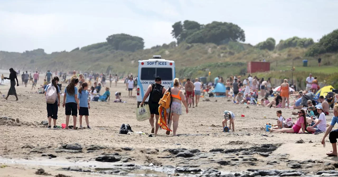  Beachgoers enjoy the glorious weather at Portmarnock beach