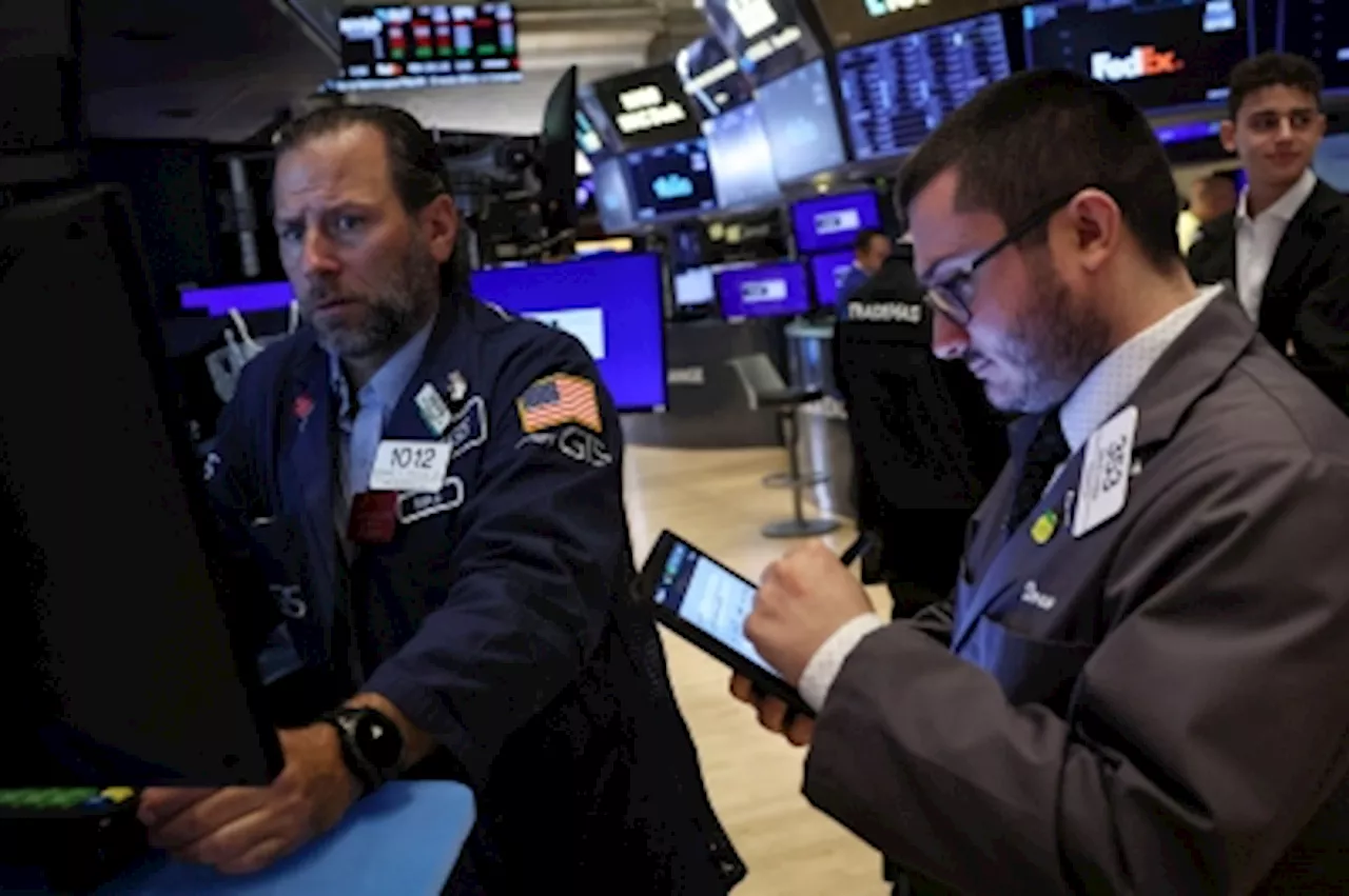 Dow closes at a one-month high as investors broaden portfolios