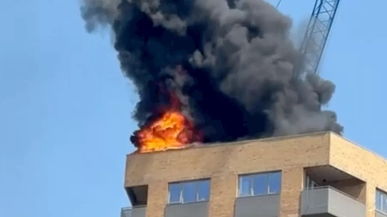 Large fire breaks out at tower block in Surrey town centre