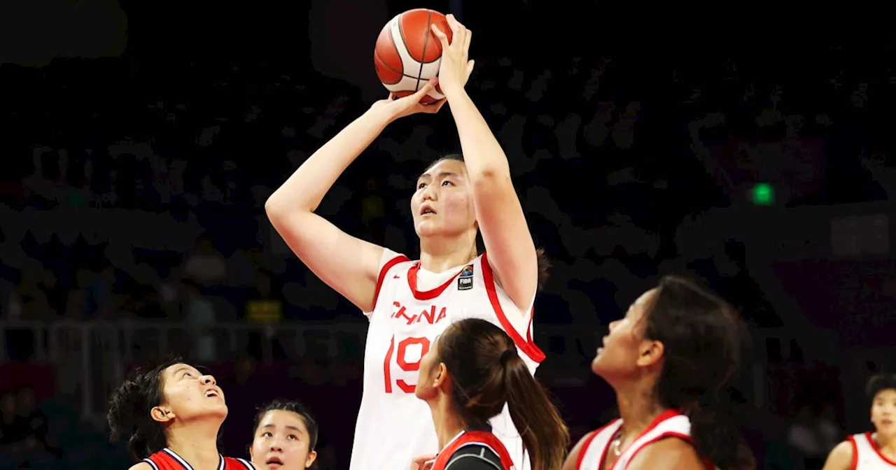 China’s 7-foot-3 teen basketball star towers over her competitors in viral video