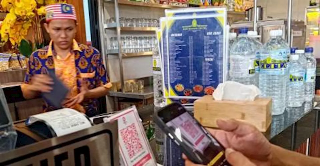 Food seller gets compound for charging 10 sen to use QR code