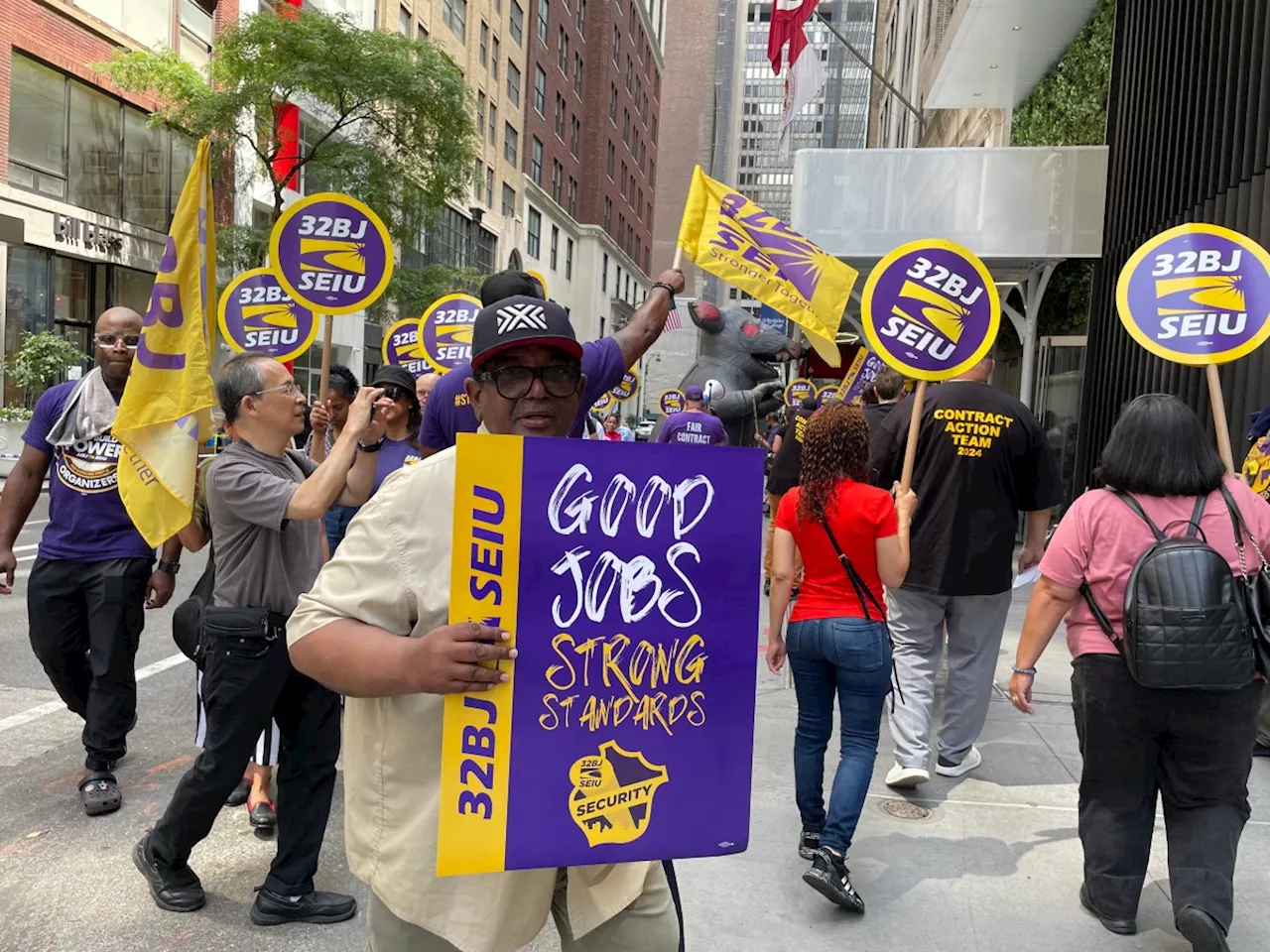 Union members rally after new landlord fires workers, cuts wages at Midtown office building