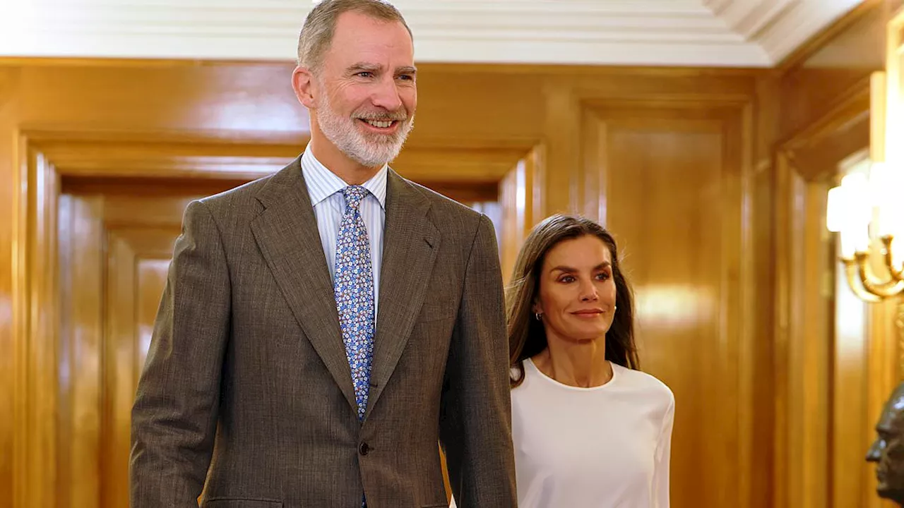 Queen Letizia of Spain looks stylish in a tie dye pleated skirt alongside King Felipe for meeting at...