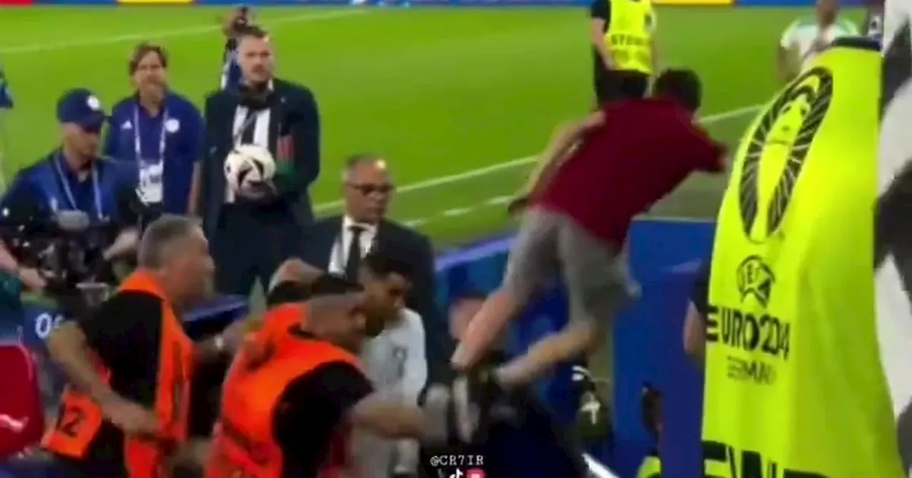 Cristiano Ronaldo avoids injury narrowly as fan jumps from stands towards star