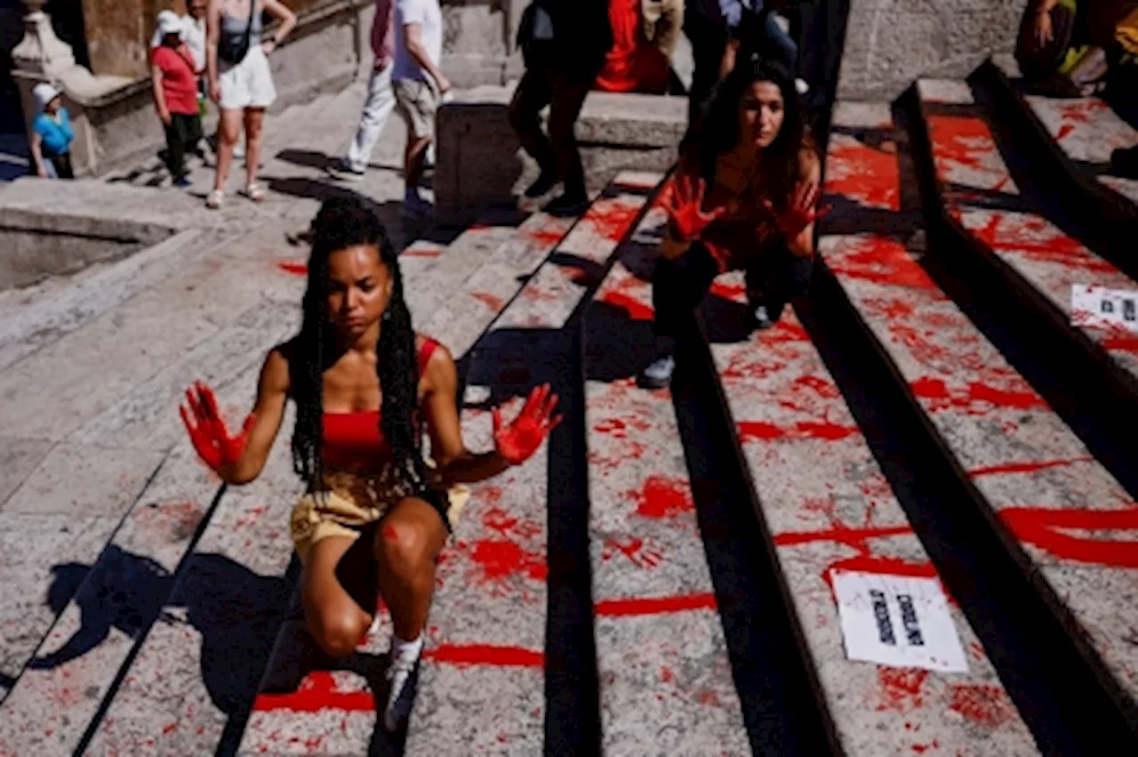 Women’s rights activists paint Rome’s Spanish Steps red