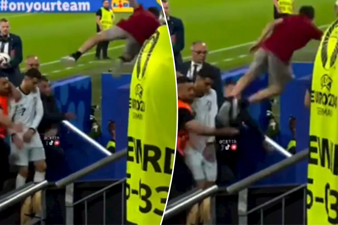 Cristiano Ronaldo narrowly misses being struck by flying fan in wild Euro 2024 scene