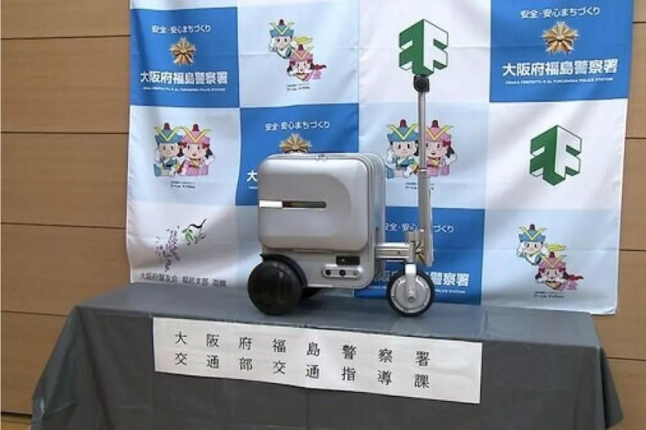 Woman charged in Japan over riding electric suitcase on pavement without licence