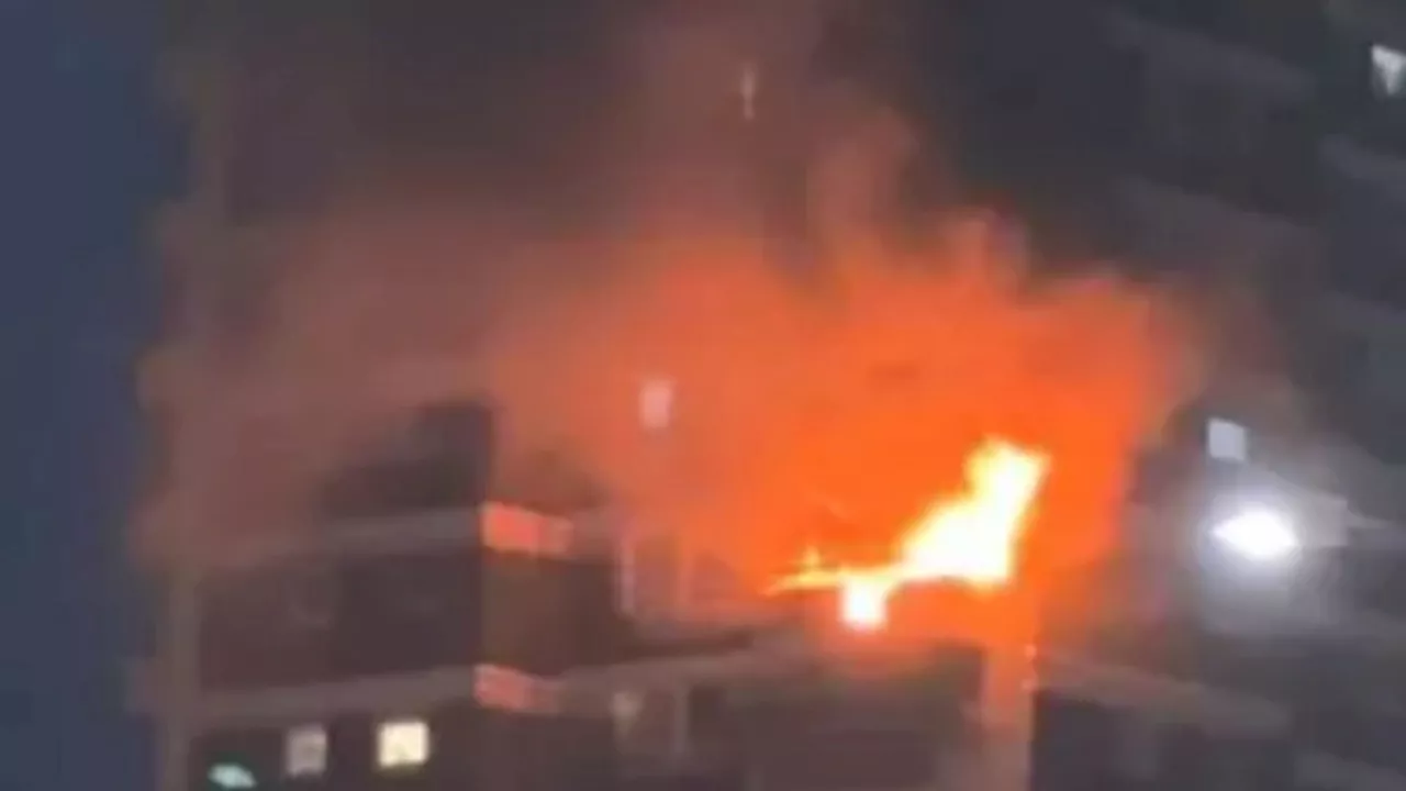 Flames leap from 10th floor flat as raging inferno spreads through Woolwich tower block & 70 firefighters...