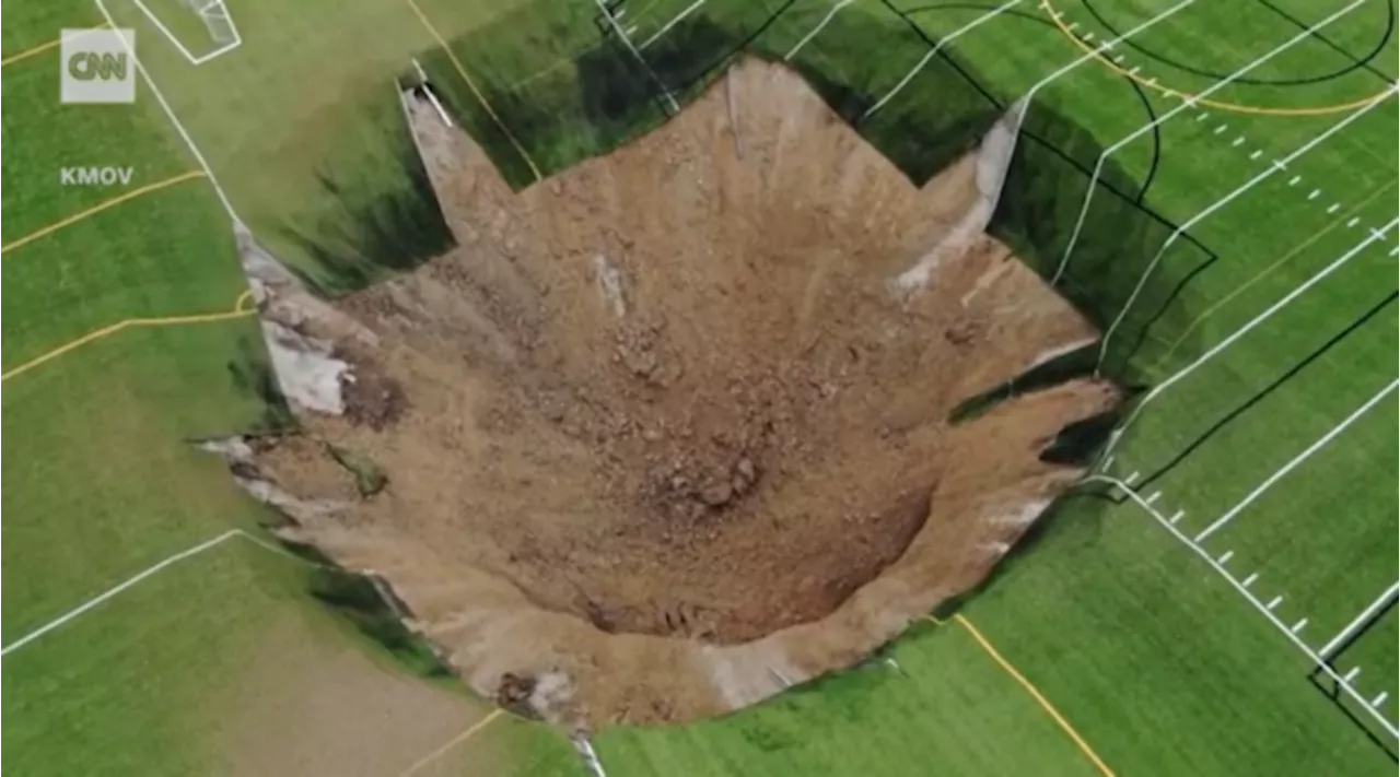 Terrifying moment massive sinkhole swallows soccer pitch in Illinois