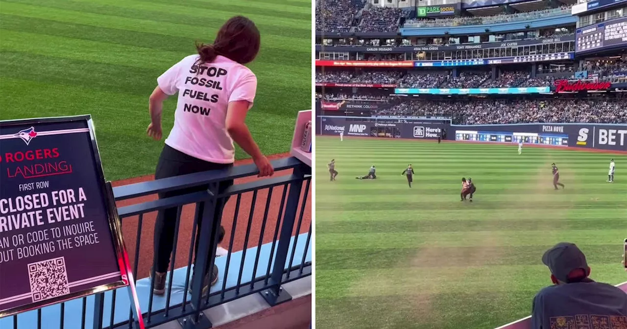 Activists tackled after rushing Rogers Centre field during Toronto Blue Jays game