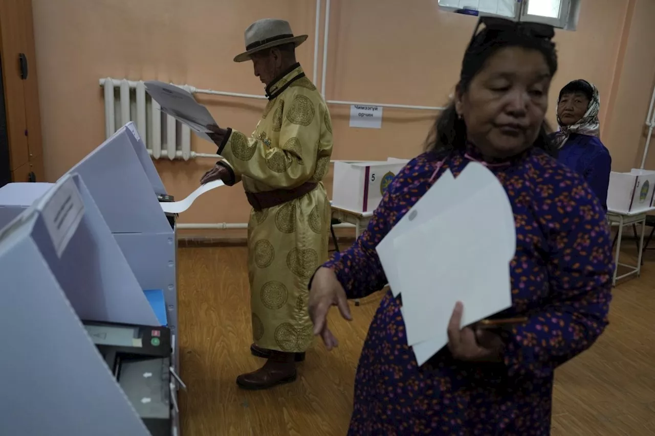 The young democracy of Mongolia begins voting for an expanded 126-seat parliament