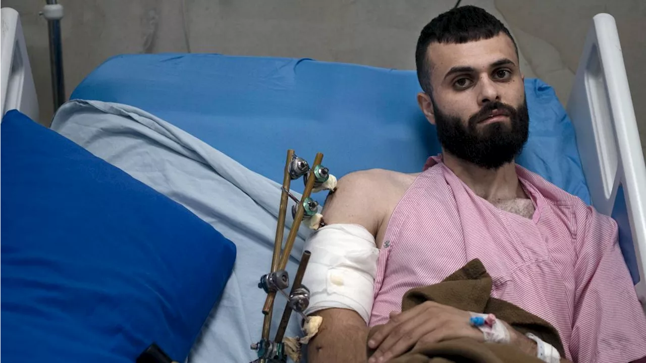 A Palestinian was shot, beaten and tied to an Israeli army jeep. The army says he posed no threat