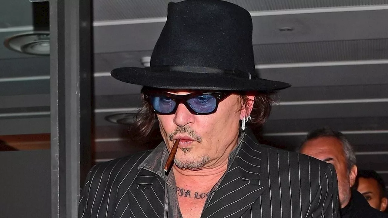 Johnny Depp appears in bright spirits during rare sighting after partying into the wee hours with...