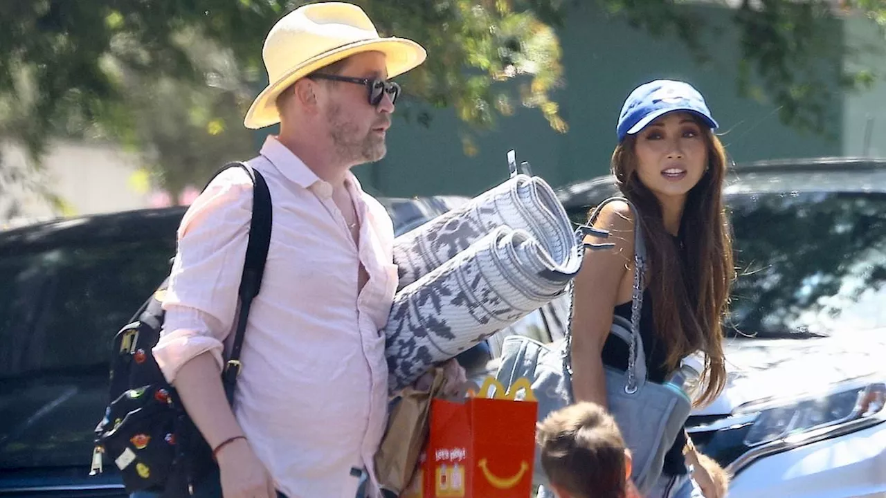 Macaulay Culkin enjoys a sunny family outing with fiancee Brenda Song and two sons in Sherman...