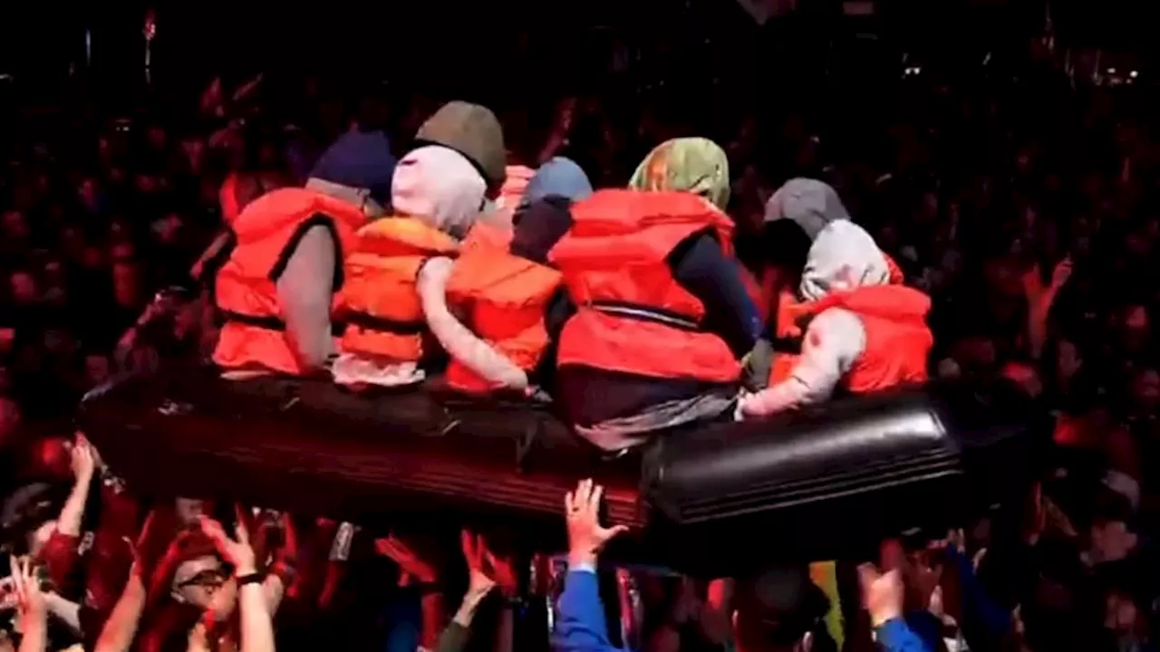 Banksy let loose inflatable boat with dummy migrants onto crowd at Glastonbury during Idles gig