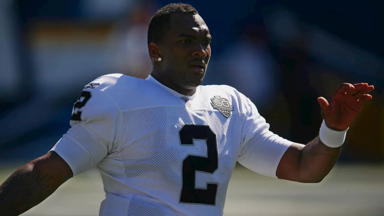 Former No. 1 pick JaMarcus Russell fired as coach, faces lawsuit