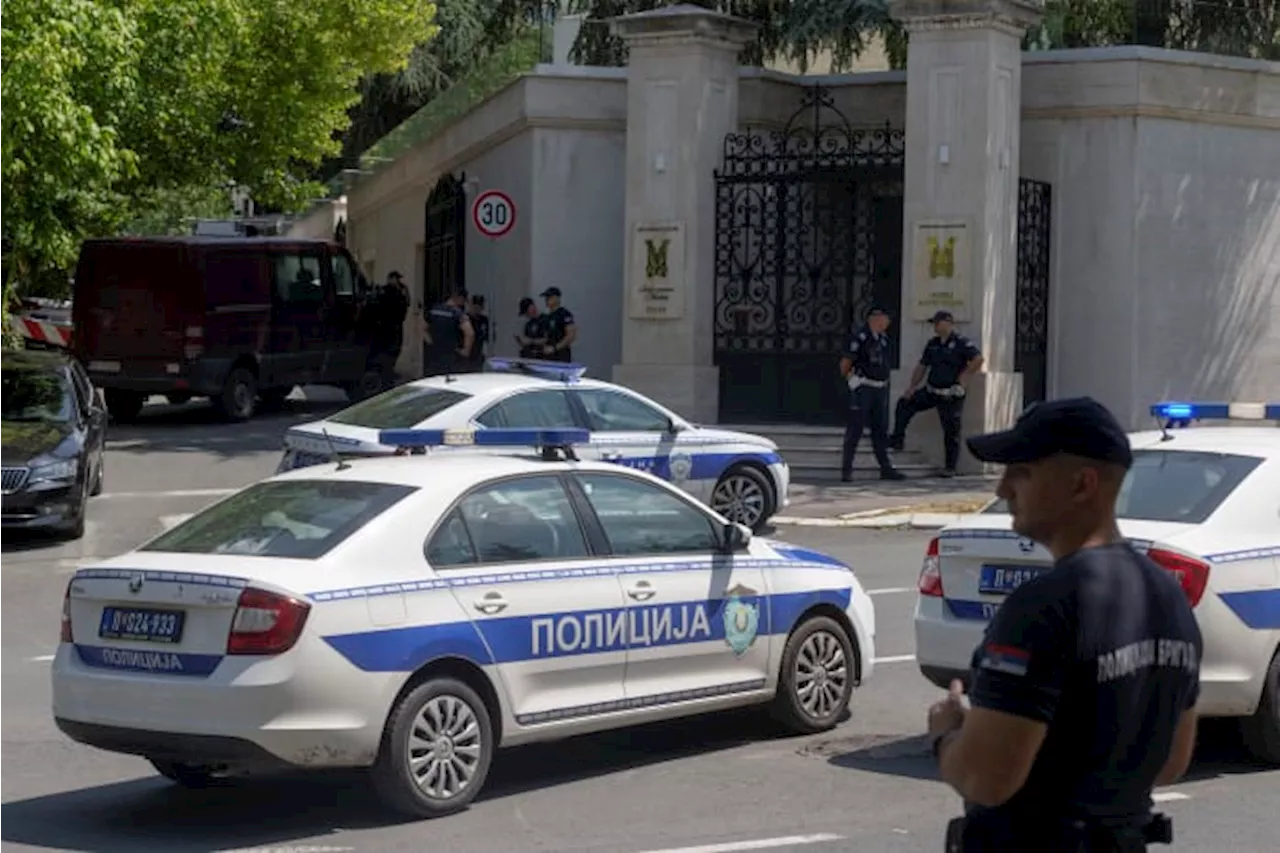 An attacker wounds a police officer guarding Israel's embassy in Serbia before being shot dead